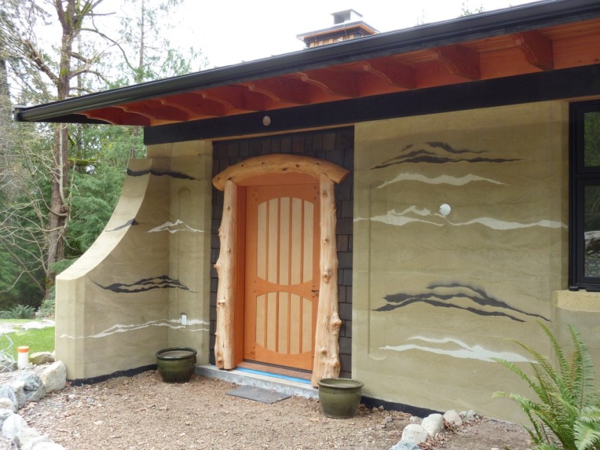 Fir-and-Maple-front-dodr-with-Log-surround-on-Rammed-Earth-house-1024x768